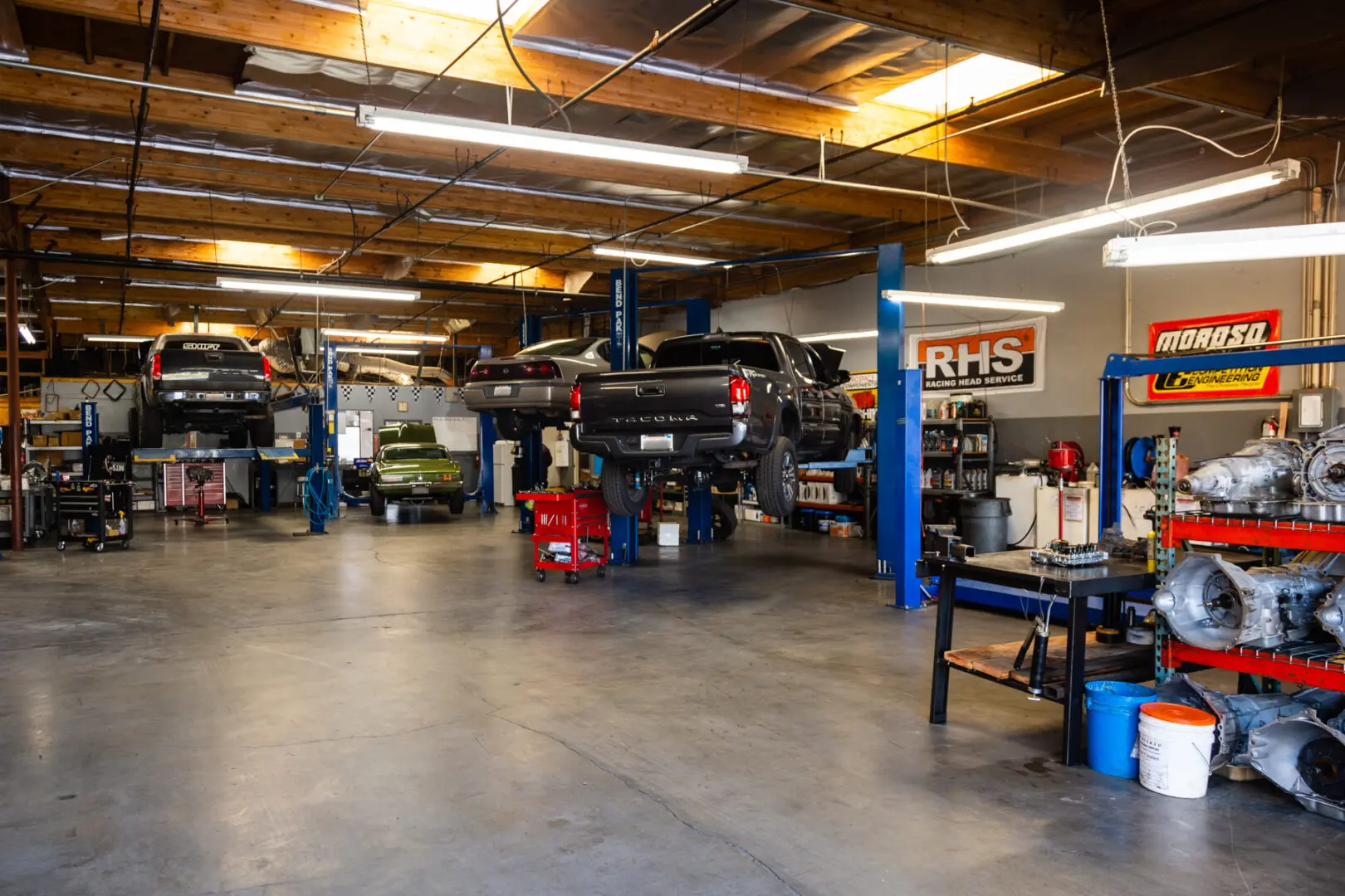 A garage with many cars in it